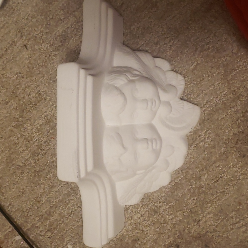 Ceramic baby angels shelf